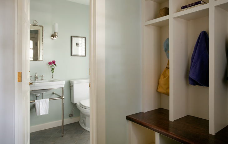 Tailored powder room convenient to adjacent mudroom entry by Blue Jay Design of Wellesley, MA