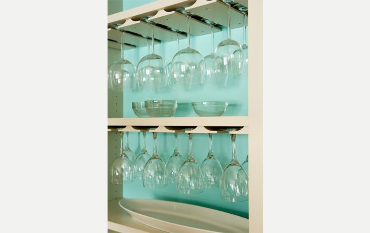 Fresh blue backdrop in a built-in kitchen shelf by Blue Jay Design of Wellesley, MA