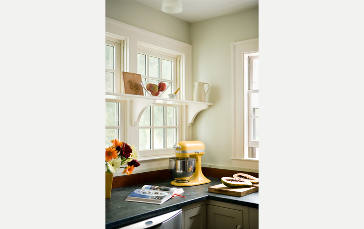 Added display from a custom window shelfin a kitchen by Blue Jay Design of Wellesley, MA