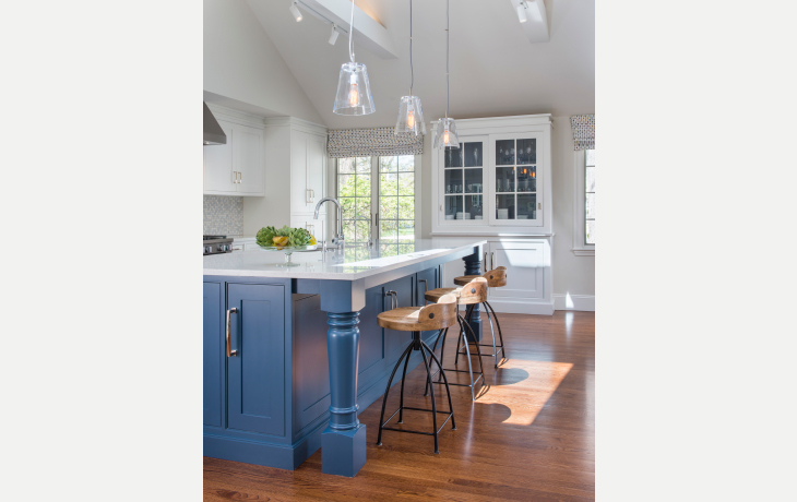 Handblown glass pendants contrast with rustic wood and iron stools by Blue Jay Design of Wellesley, MA