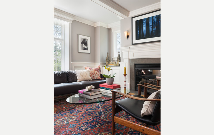 Modern furnishings and an antique Oriental rug are combined in a formal living room by Blue Jay Design of Wellesley, MA