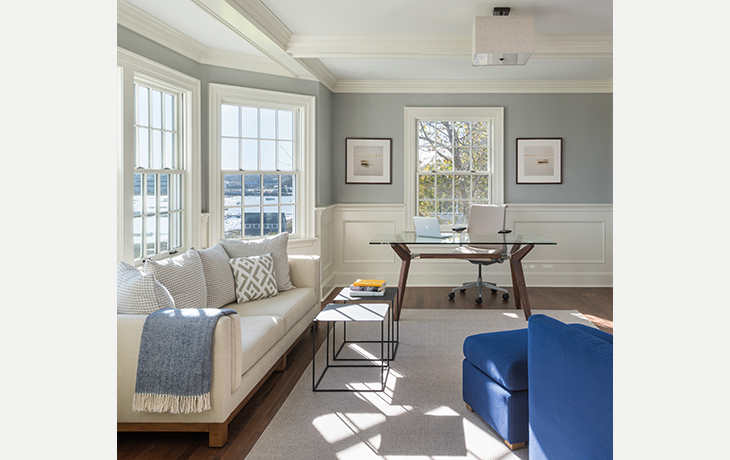 A light and airy home office provides space for work and relaxation by Blue Jay Design of Wellesley, MA