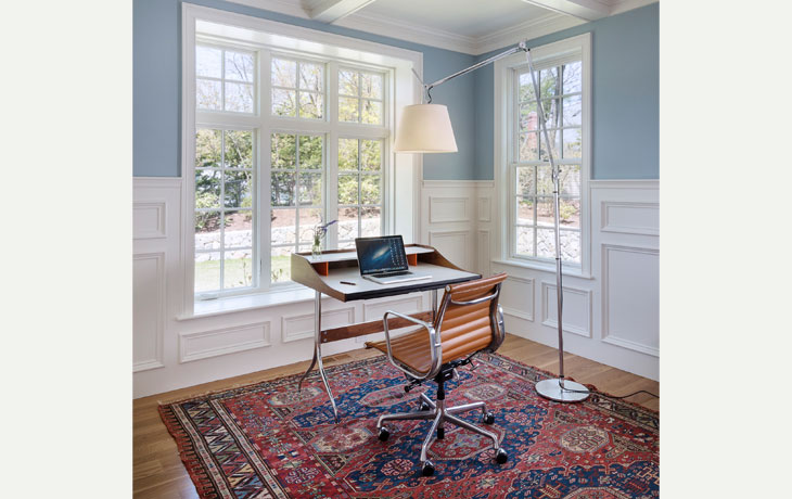 Crisp millwork and modern furnishings combine in an office by Blue Jay Design of Wellesley, MA